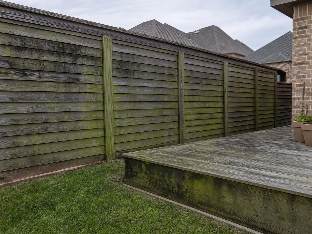 Cedar fence and deck before cleaning